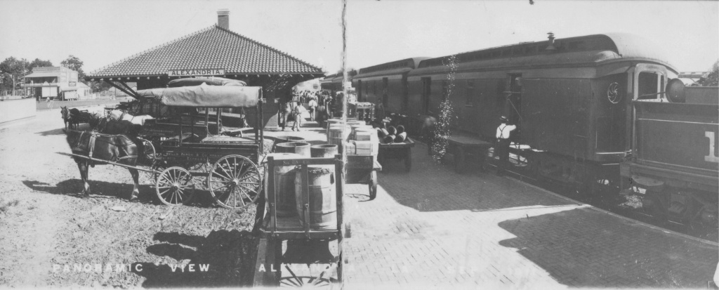Panoramic view of the north side of Union Station, Alexandria, Louisiana, circa 1910-15, with horse-drawn wagons meeting the train